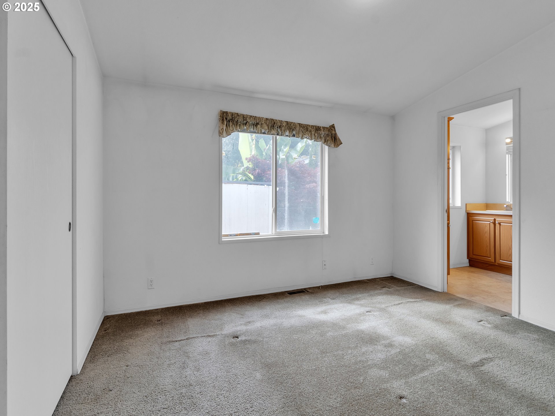 1005 Ferry Street, Unit 26 Dayton, OR 97114 - Photo 13 of 15 an empty room with windows