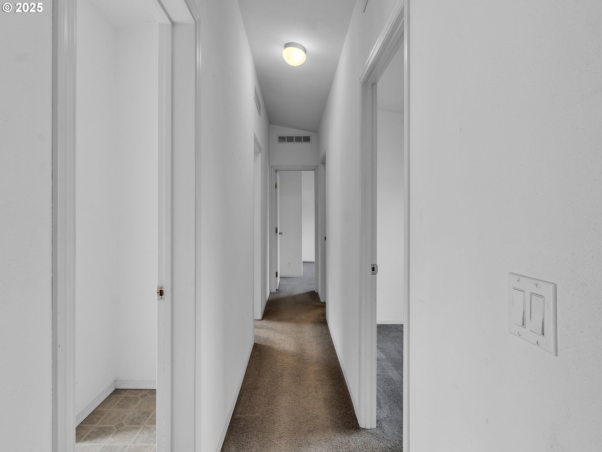 1005 Ferry Street, Unit 26 Dayton, OR 97114 - Photo 9 of 15 a view of a hallway with wooden floor