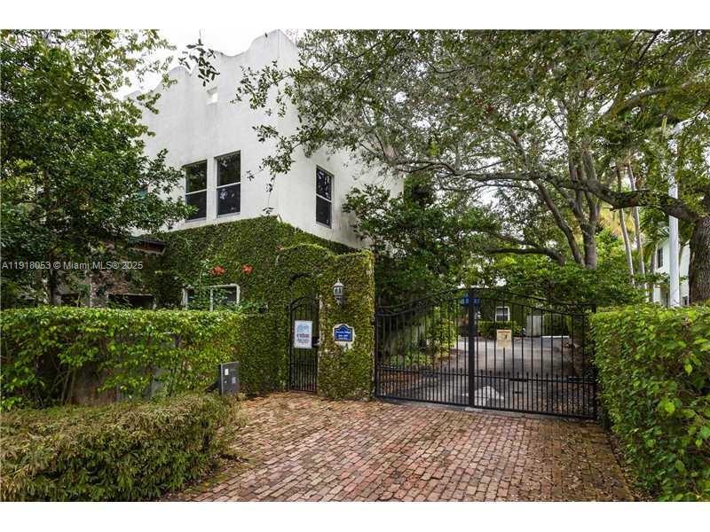 3051 Center Street, Unit 9 Miami, FL 33133 - Photo 1 of 11 a view of a house with a yard