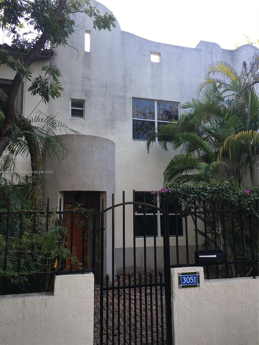 3051 Center Street, Unit 9 Miami, FL 33133 - Photo 2 of 11 a sign that is on the side of a building