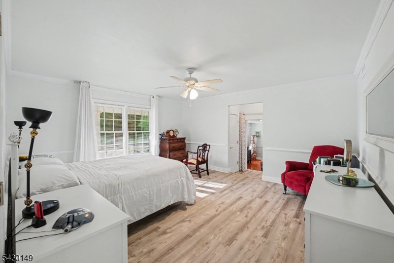 325 Matchaponix Road Old Bridge, NJ 08831 - Photo 12 of 21 a bedroom with furniture and a chandelier