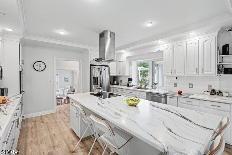 325 Matchaponix Road Old Bridge, NJ 08831 - Photo 14 of 21 a kitchen with a sink a stove cabinets and living room view