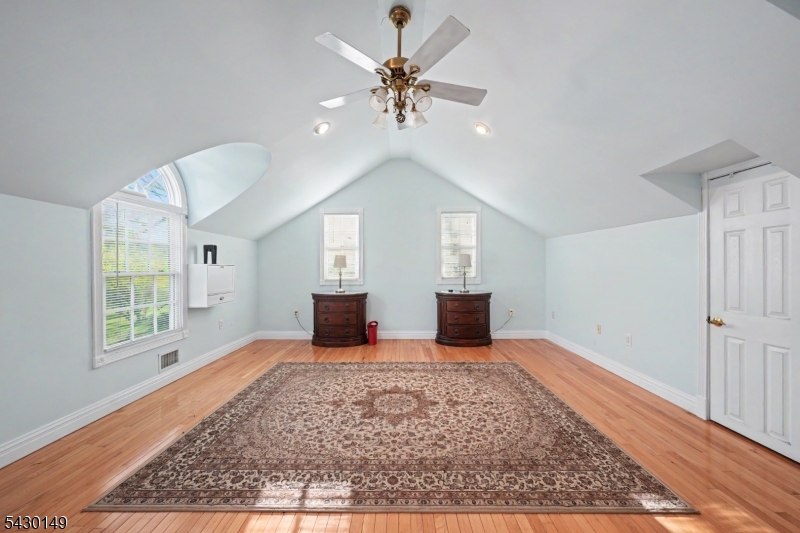 325 Matchaponix Road Old Bridge, NJ 08831 - Photo 16 of 21 a view of an empty room with window and wooden floor