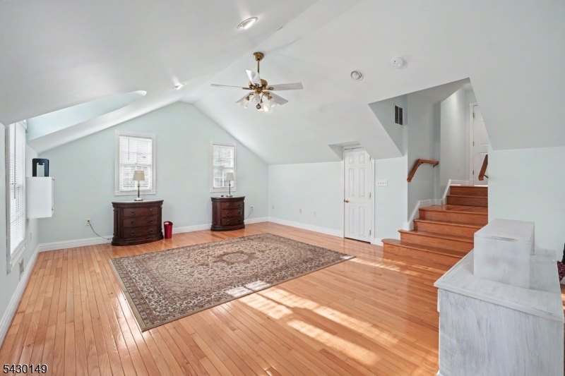325 Matchaponix Road Old Bridge, NJ 08831 - Photo 17 of 21 a bedroom with a bed and a chandelier