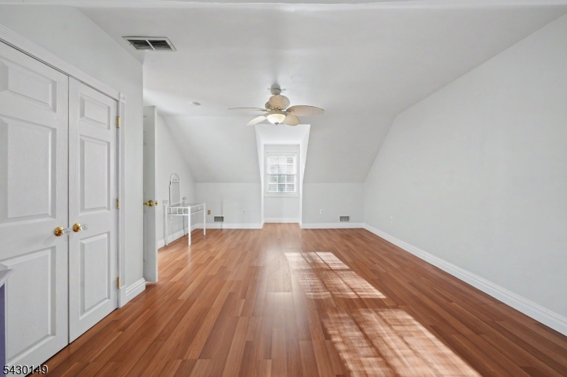 325 Matchaponix Road Old Bridge, NJ 08831 - Photo 20 of 21 wooden floor in an empty room with a window