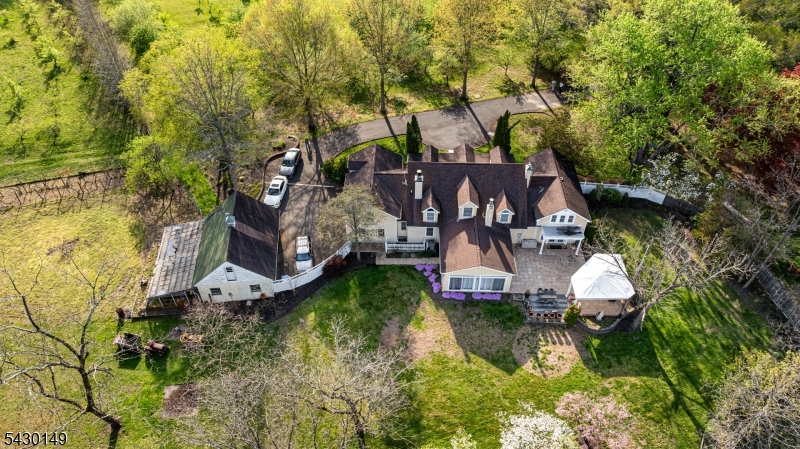 325 Matchaponix Road Old Bridge, NJ 08831 - Photo 2 of 21 an aerial view of a house with swimming pool a yard and a large tree