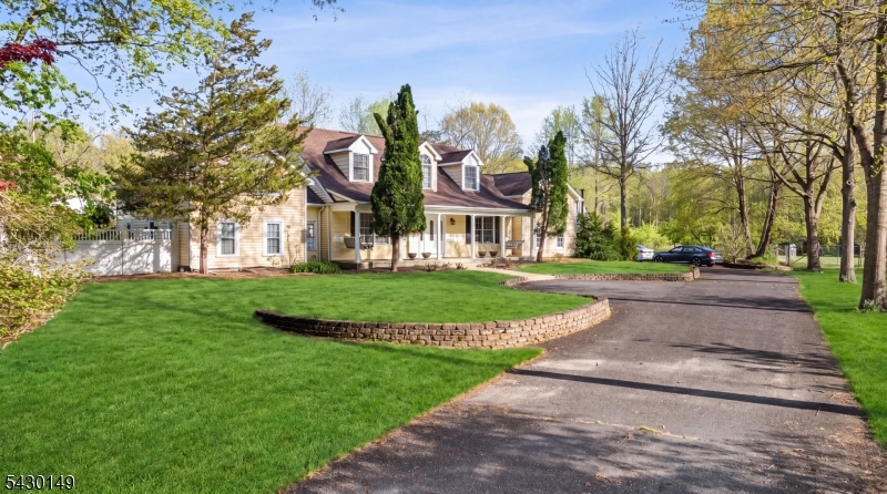 325 Matchaponix Road Old Bridge, NJ 08831 - Photo 4 of 21 a front view of a building with a garden and trees