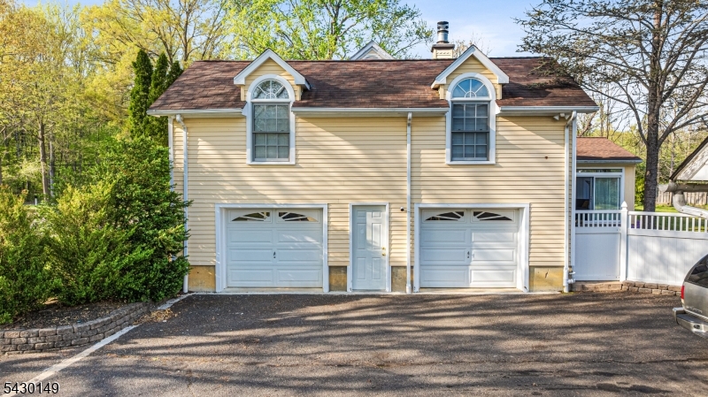 325 Matchaponix Road Old Bridge, NJ 08831 - Photo 8 of 21 a front view of a house with a yard and garage
