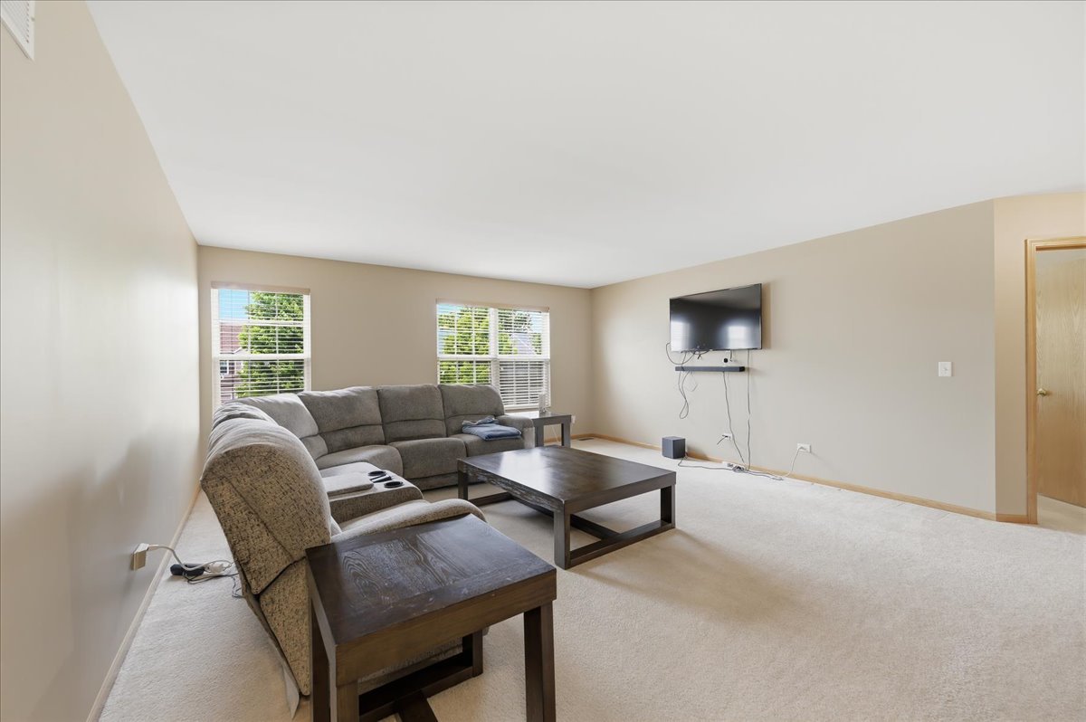 1916 Castle Ridge Drive Plainfield, IL 60586 - Photo 16 of 36 a living room with furniture and a window