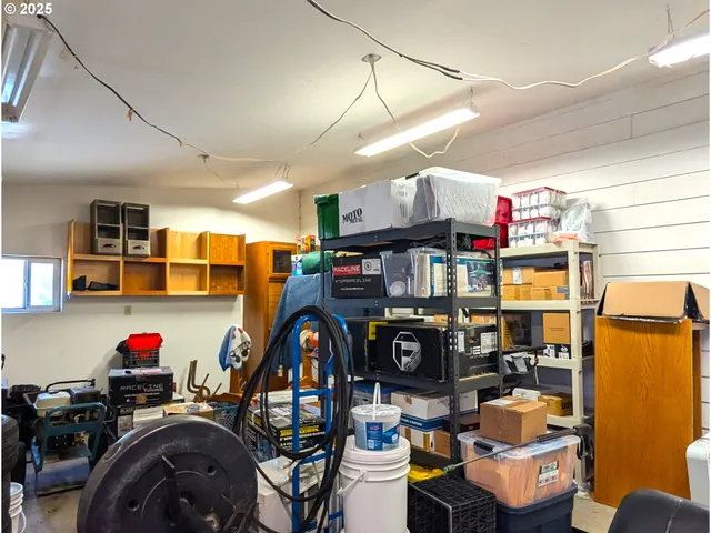 a room with a workspace and a couch