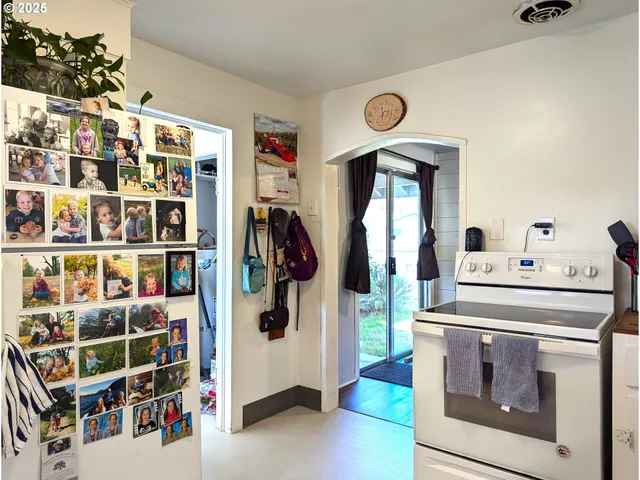a wooden bench sitting in front of a building