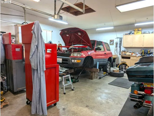 a view of a house with pool and sitting area