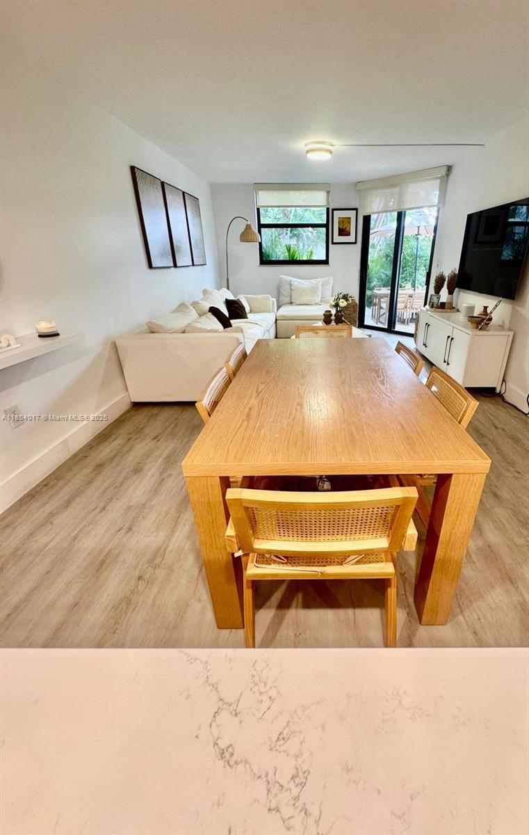 55 Ocean Ln Drive, Unit 1018 Key Biscayne, FL 33149 - Photo 17 of 36 a bed sitting in a bedroom and table