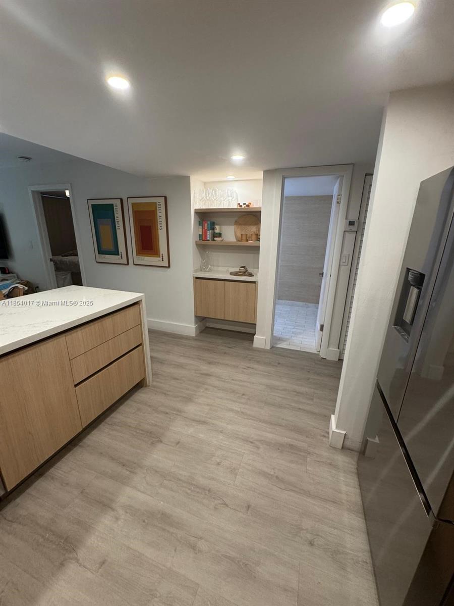 55 Ocean Ln Drive, Unit 1018 Key Biscayne, FL 33149 - Photo 9 of 36 a bathroom with a sink a toilet and mirror