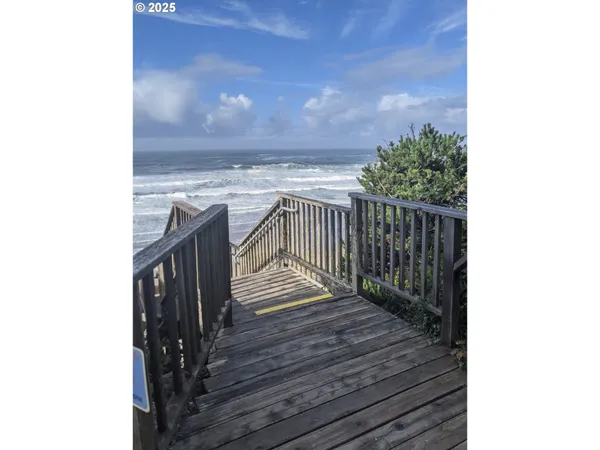 a view of balcony with wooden floor