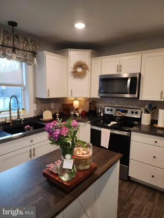 a kitchen with a stove and a microwave