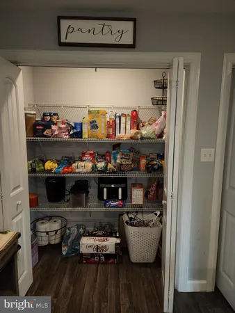 a kitchen with lots of bottles of alcohol