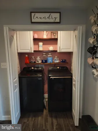 a kitchen with stainless steel appliances a stove a microwave and a refrigerator