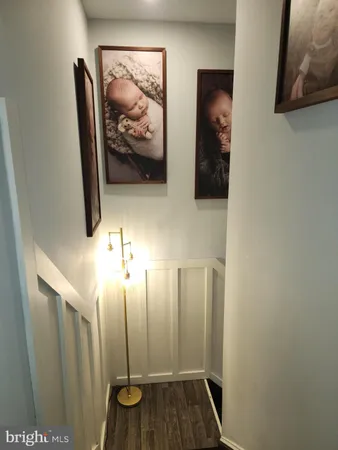 a bathroom with a sink mirror and toilet