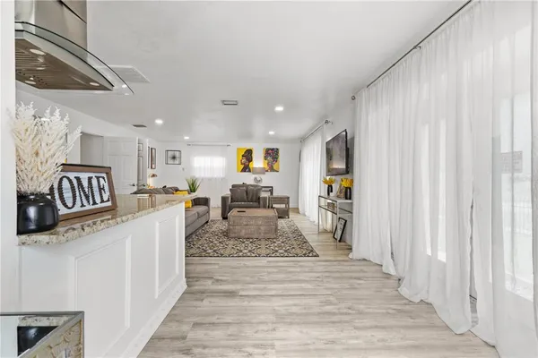 a view of a living room and a wooden floor