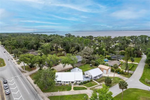 an aerial view of a house with lots of trees