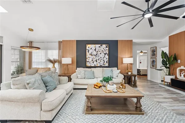 a living room with furniture and a large window