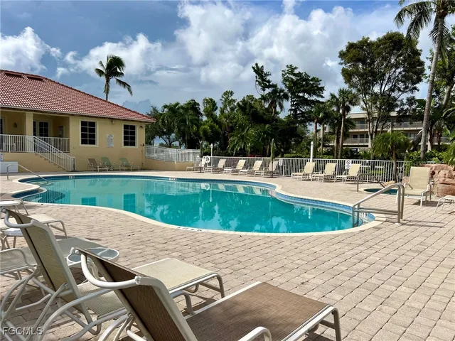 a view of a patio with swimming pool