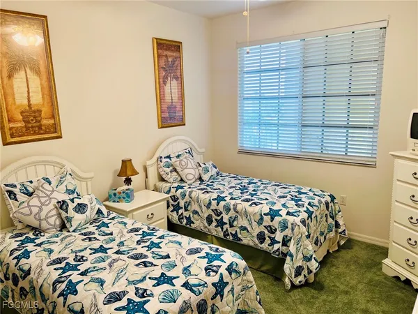 a bedroom with bed and a window