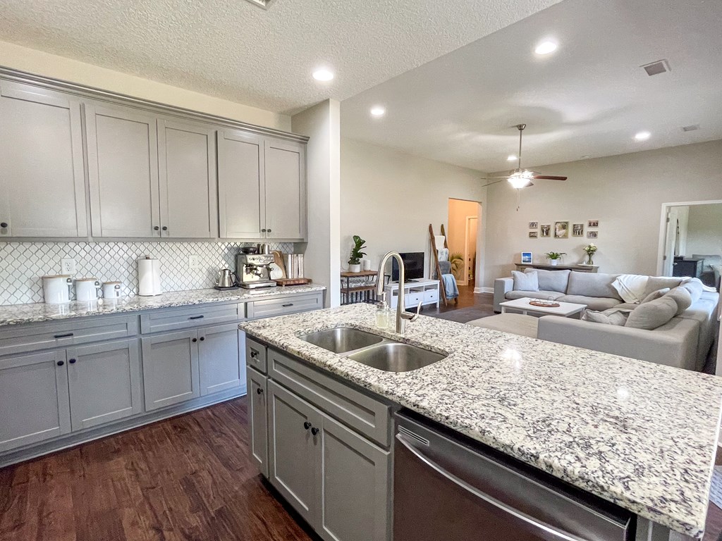 6 Cheyenne Trail Fort Mitchell, AL 36856 - Photo 12 of 33 a kitchen with granite countertop a sink a counter space appliances and cabinets