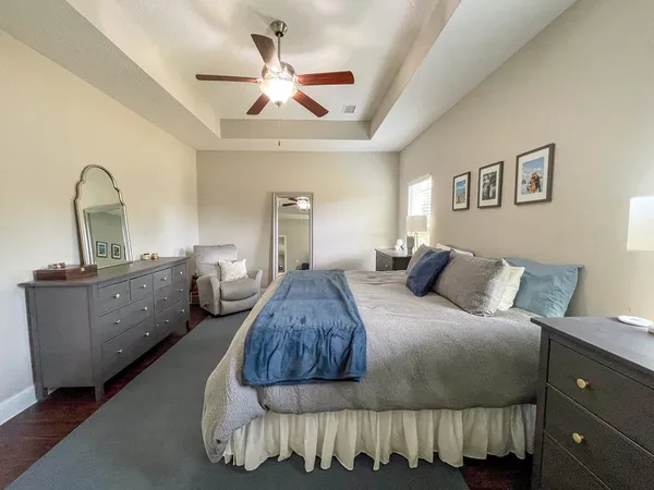 a bedroom with a bed and a dresser