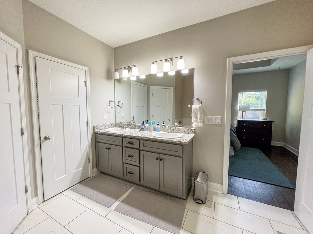 6 Cheyenne Trail Fort Mitchell, AL 36856 - Photo 16 of 33 a spacious bathroom with a double vanity sink and a mirror