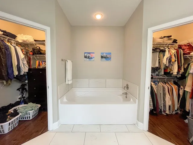 a bathroom with a tub and shower