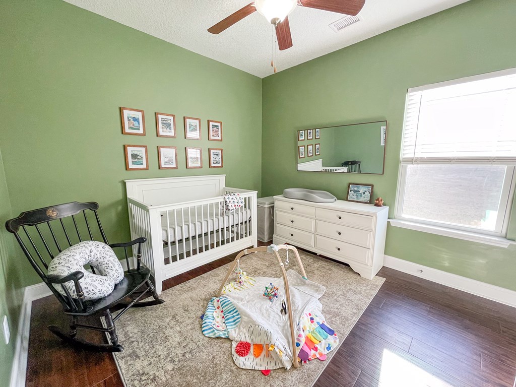 6 Cheyenne Trail Fort Mitchell, AL 36856 - Photo 20 of 33 a bedroom with furniture and a wooden floor