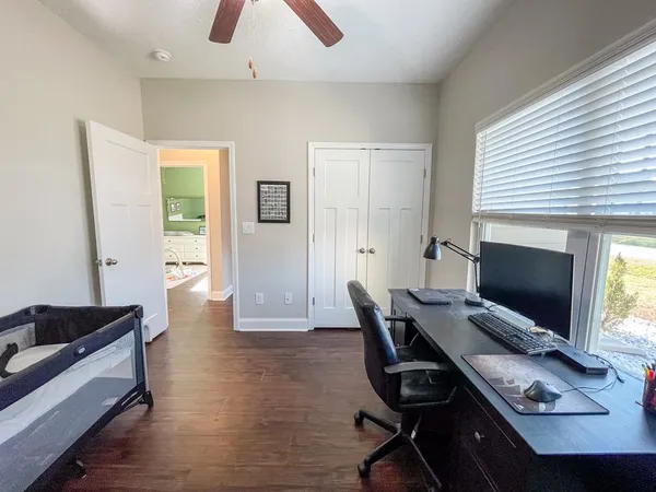 a workspace with furniture and a window