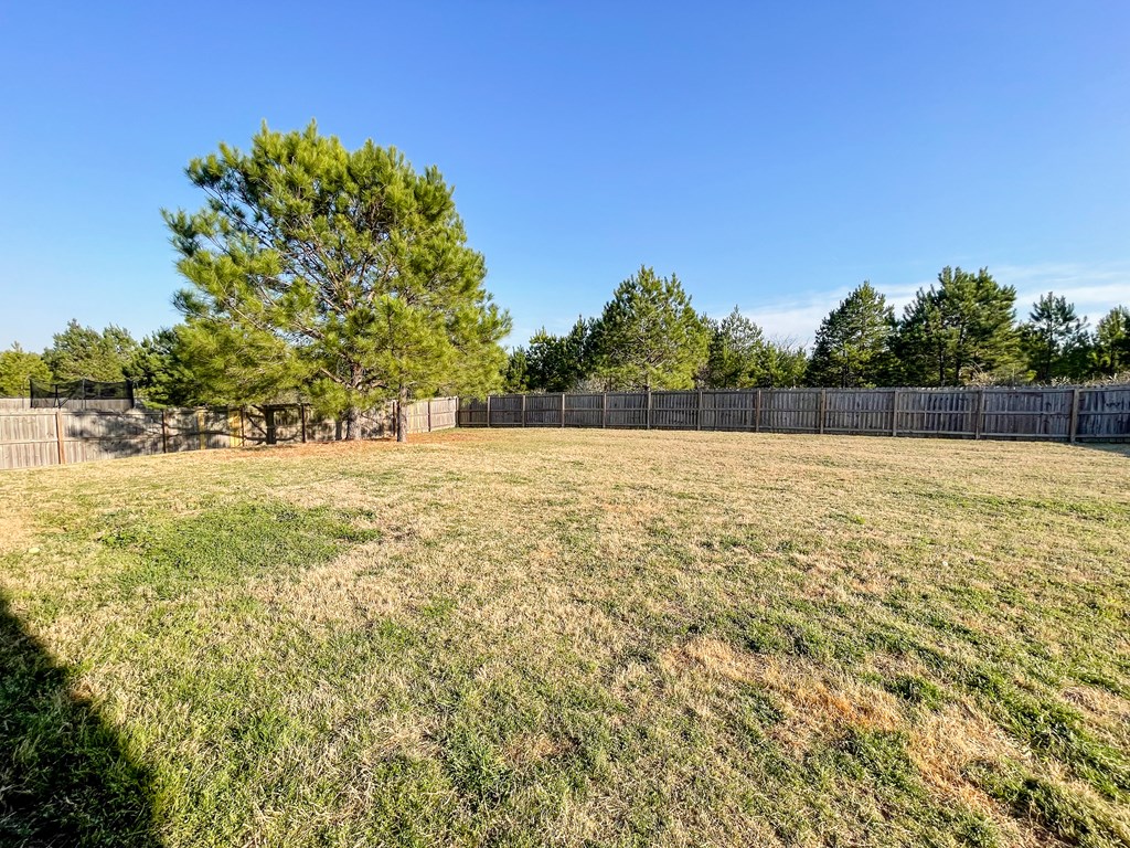 6 Cheyenne Trail Fort Mitchell, AL 36856 - Photo 33 of 33 a view of yard with swimming pool and trees in the background