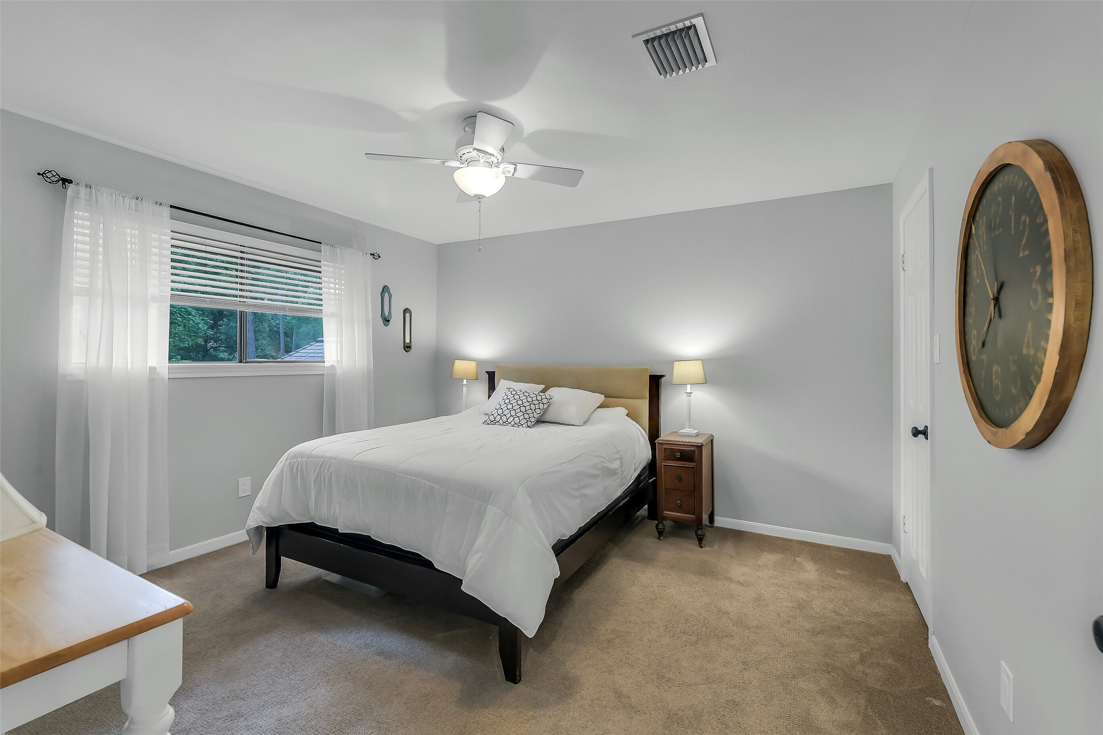 26 Split Rock Road Spring, TX 77381 - Photo 35 of 40 This fourth bedroom features a cozy atmosphere with neutral walls and a large window providing natural light.