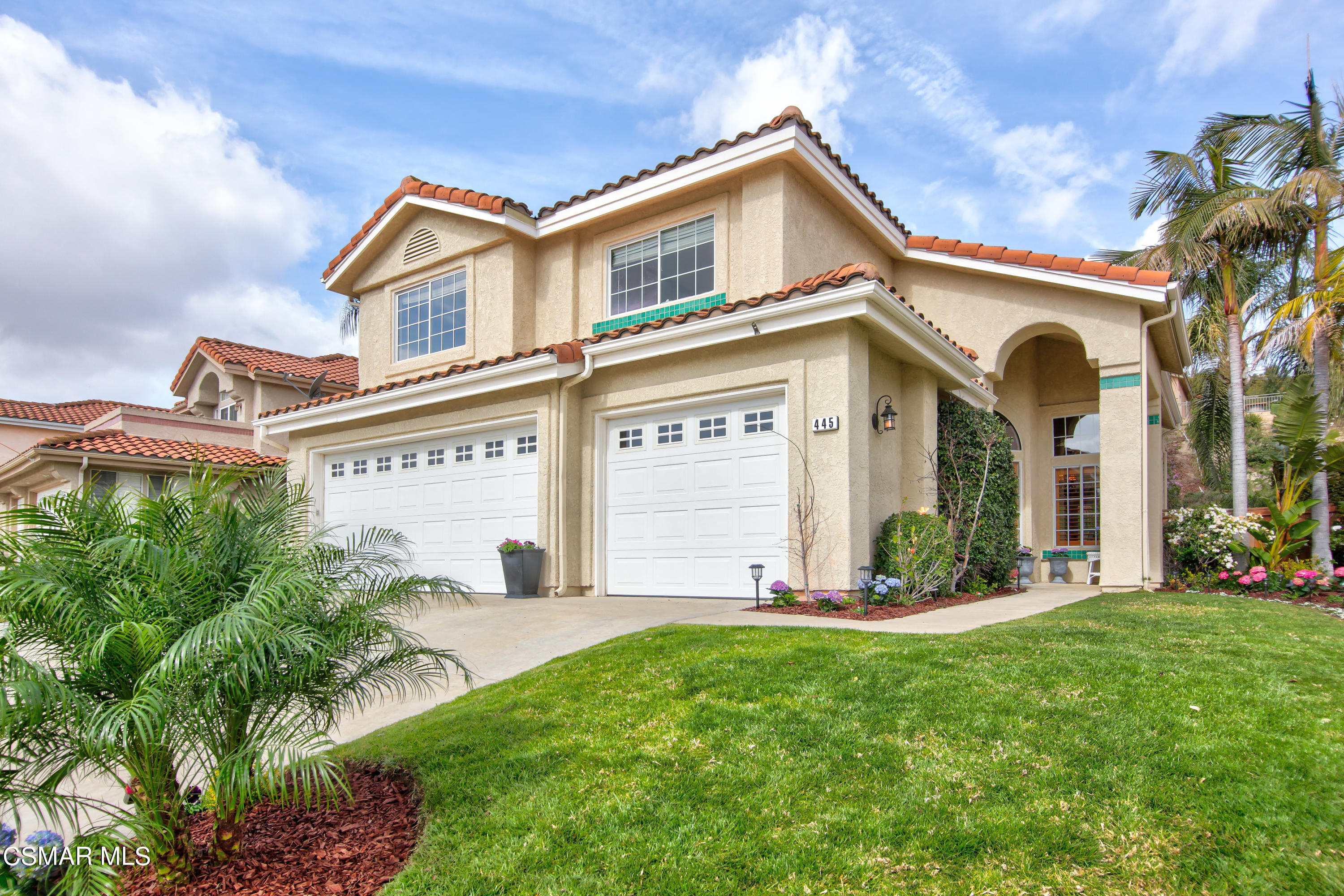445 Innwood Road Simi Valley, CA 93065 - Photo 1 of 44 a front view of a house with a yard and garage