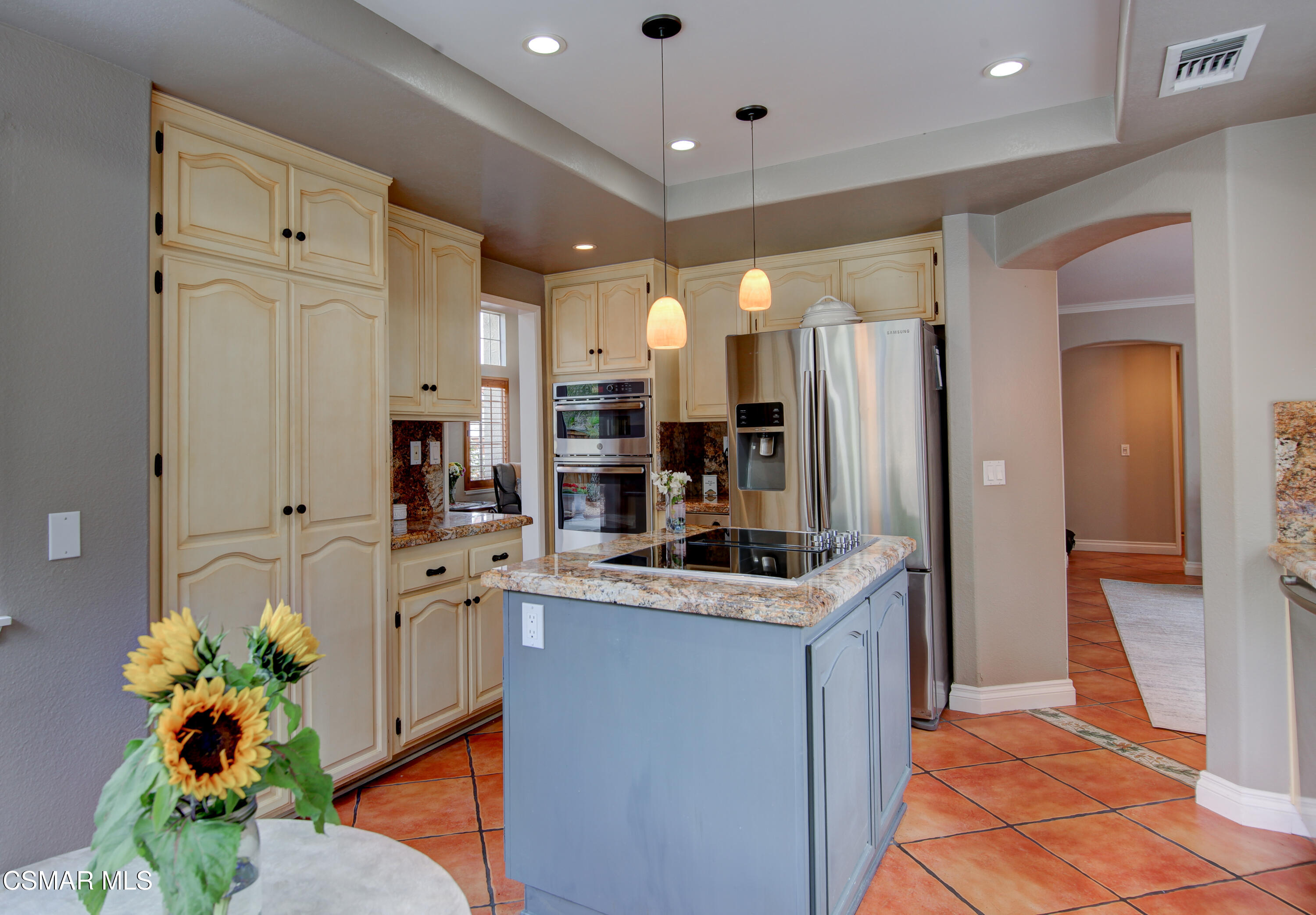 445 Innwood Road Simi Valley, CA 93065 - Photo 12 of 44 a kitchen that has a lot of white cabinets and stainless steel appliances