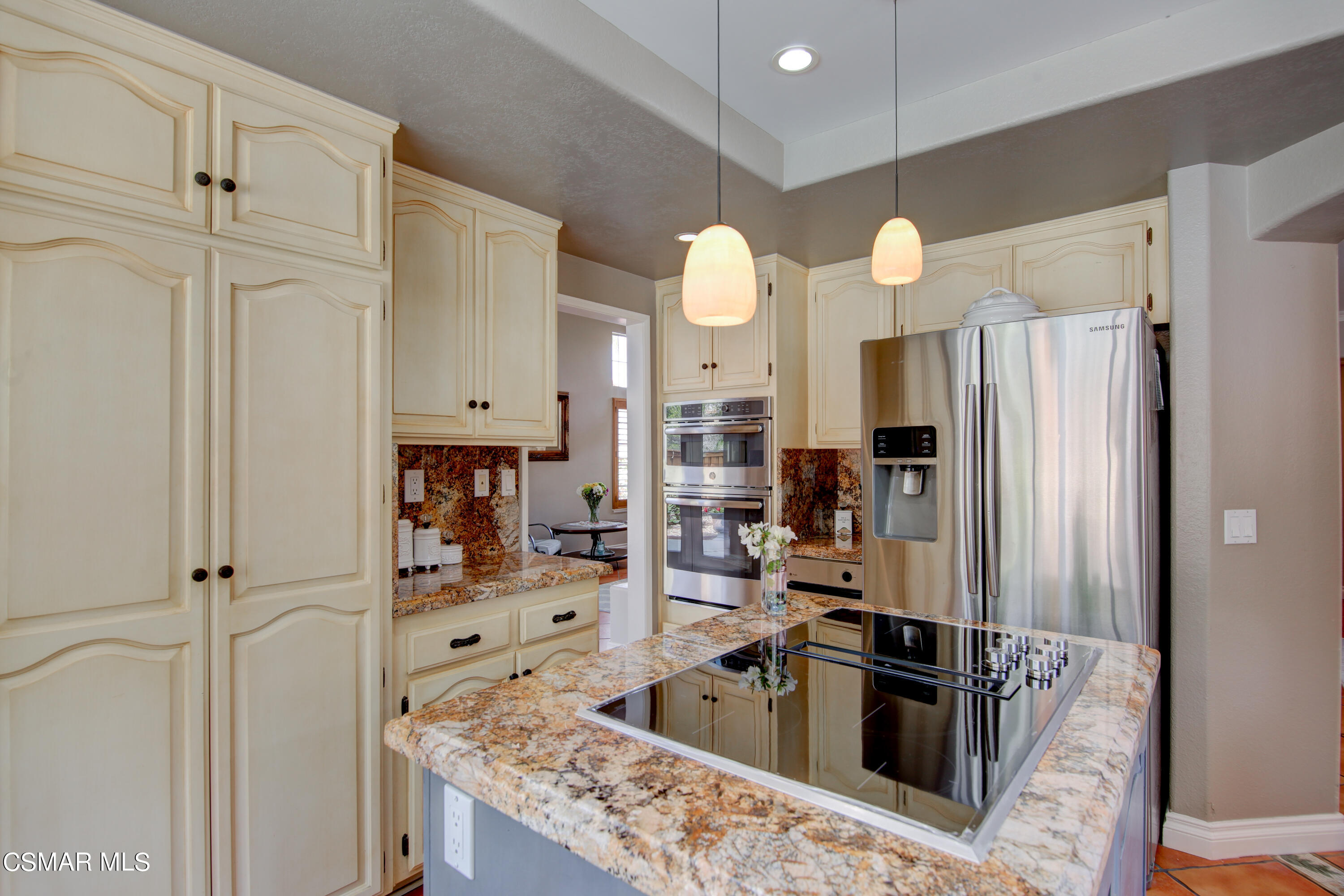 445 Innwood Road Simi Valley, CA 93065 - Photo 13 of 44 a kitchen with stainless steel appliances granite countertop a refrigerator and a sink