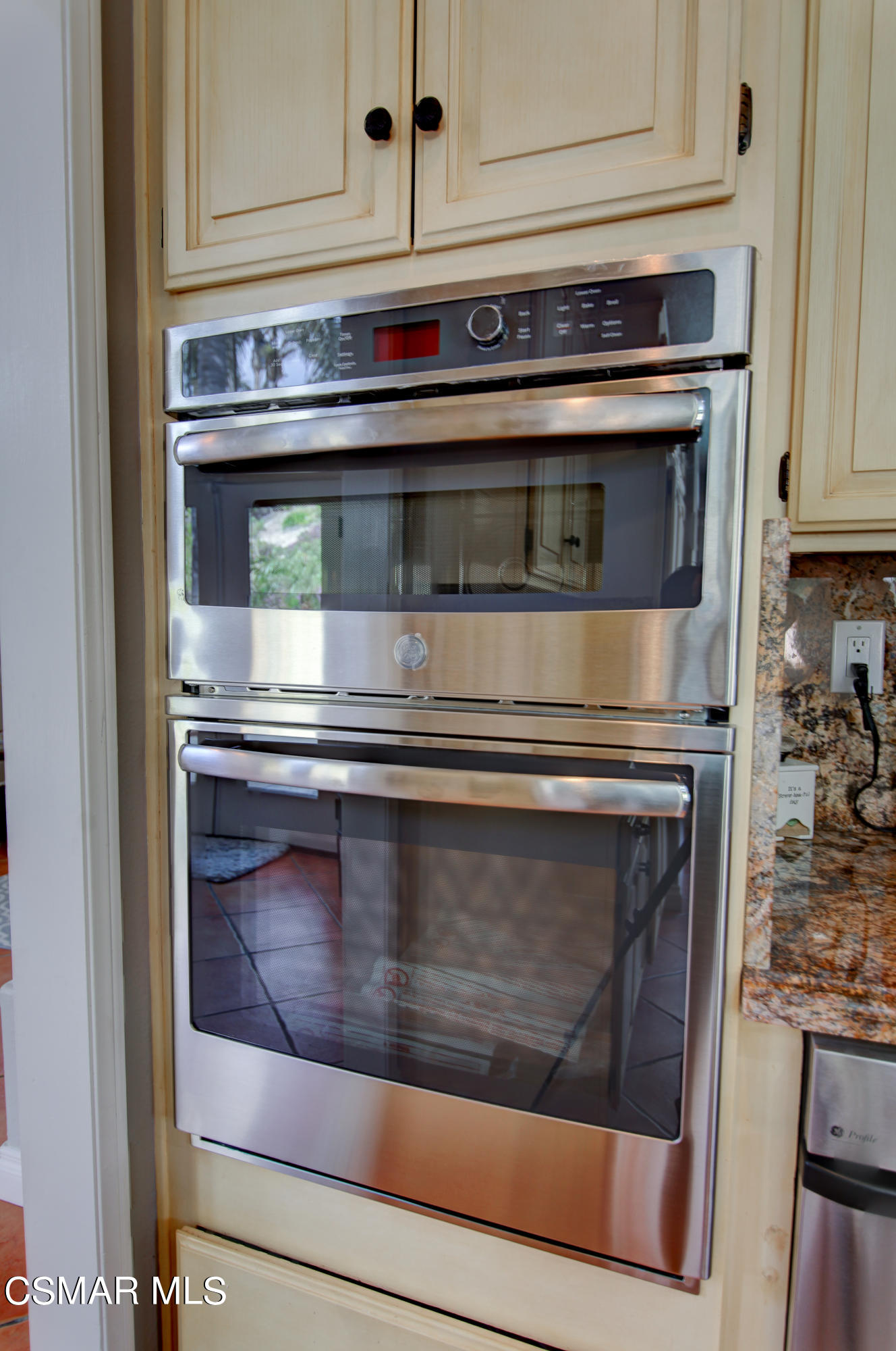 445 Innwood Road Simi Valley, CA 93065 - Photo 17 of 44 a stove top oven sitting inside of a kitchen
