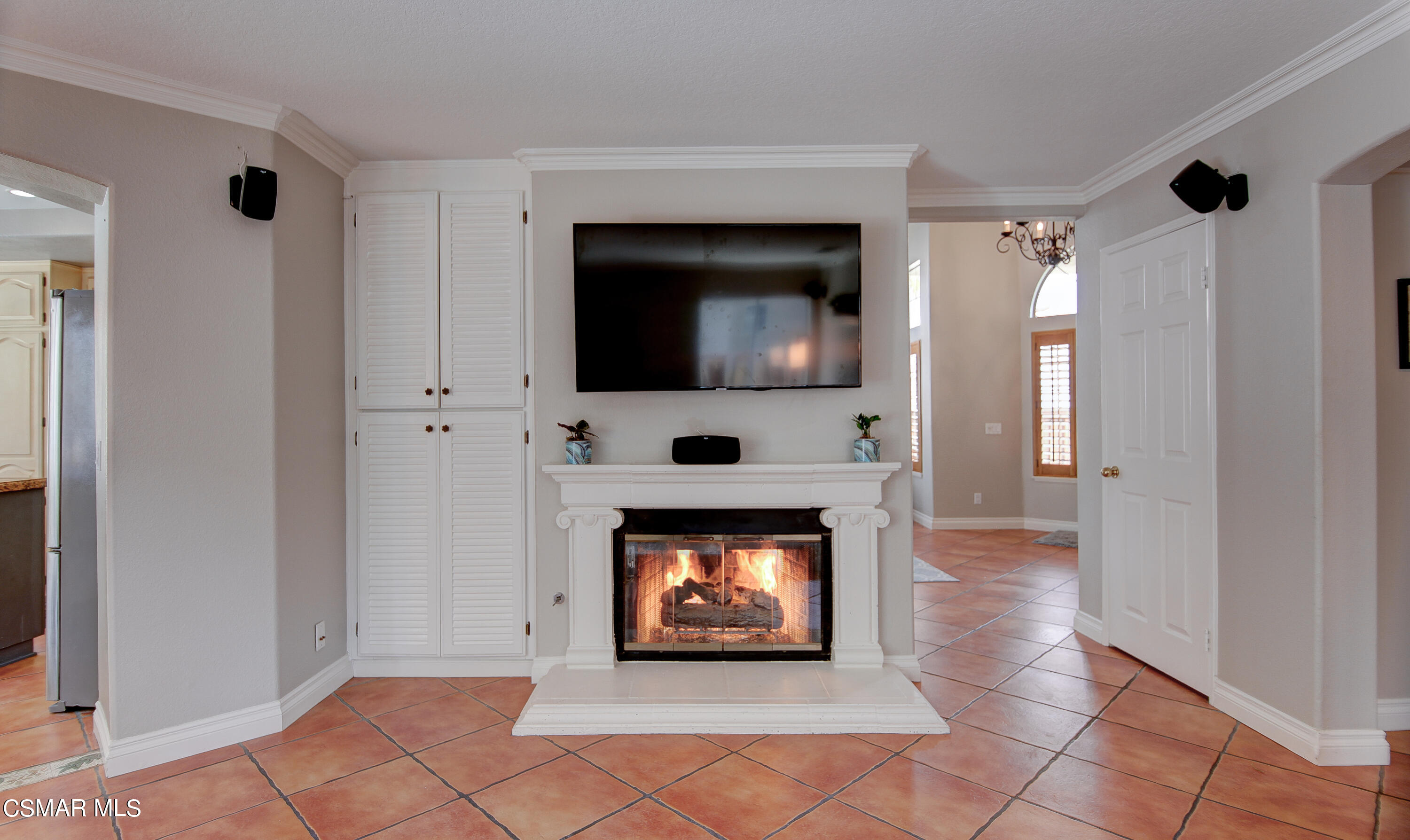 445 Innwood Road Simi Valley, CA 93065 - Photo 20 of 44 a living room with furniture a fireplace and a flat screen tv