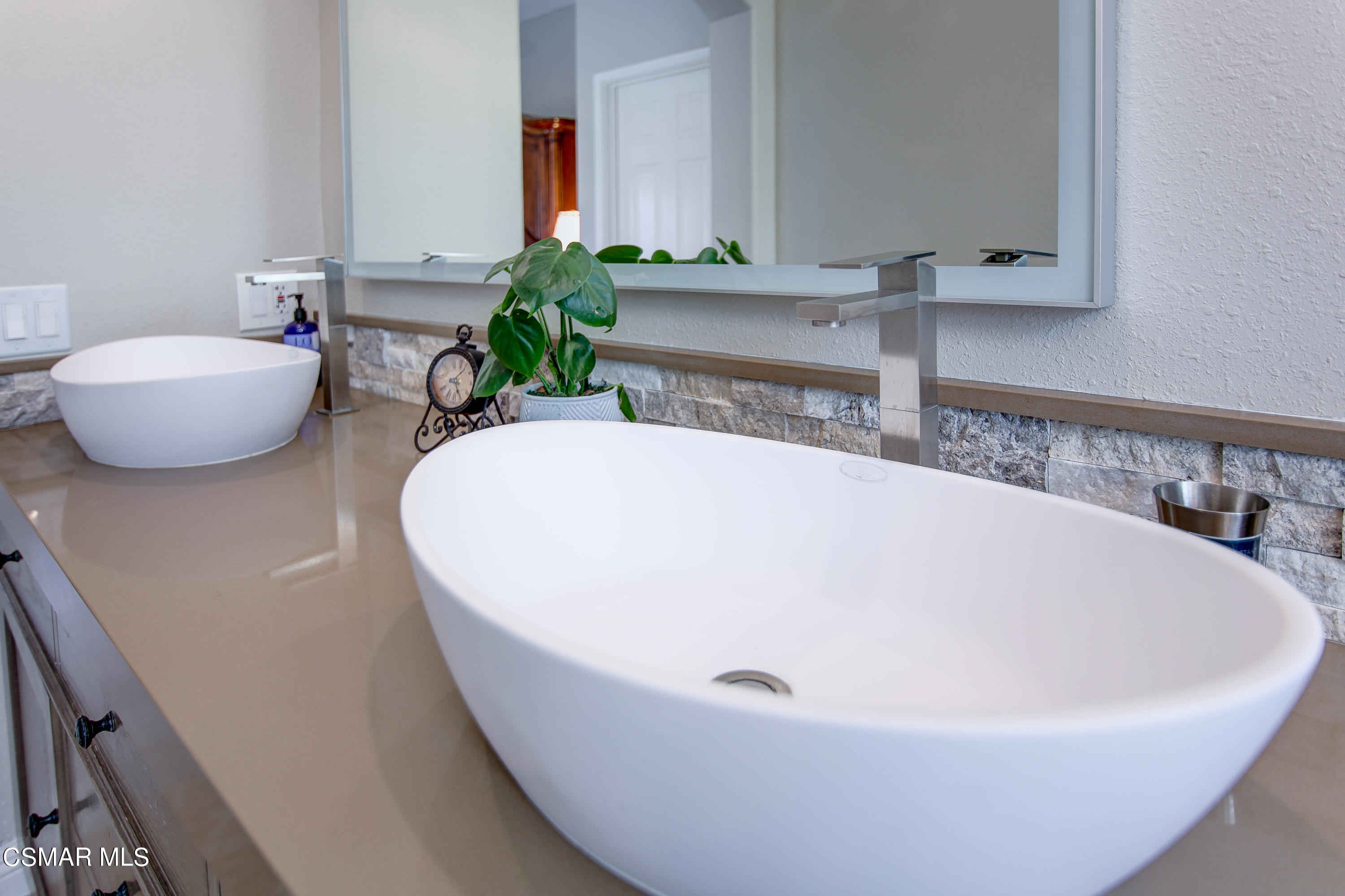 445 Innwood Road Simi Valley, CA 93065 - Photo 25 of 44 a white bath tub sitting in a bathroom