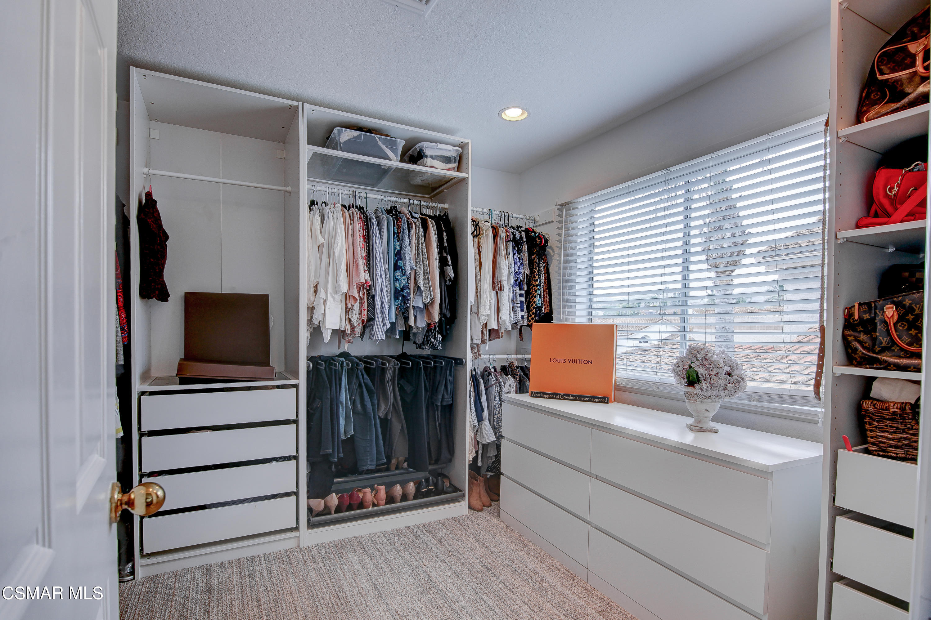 445 Innwood Road Simi Valley, CA 93065 - Photo 27 of 44 a view of walk in closet with clothes and shoes