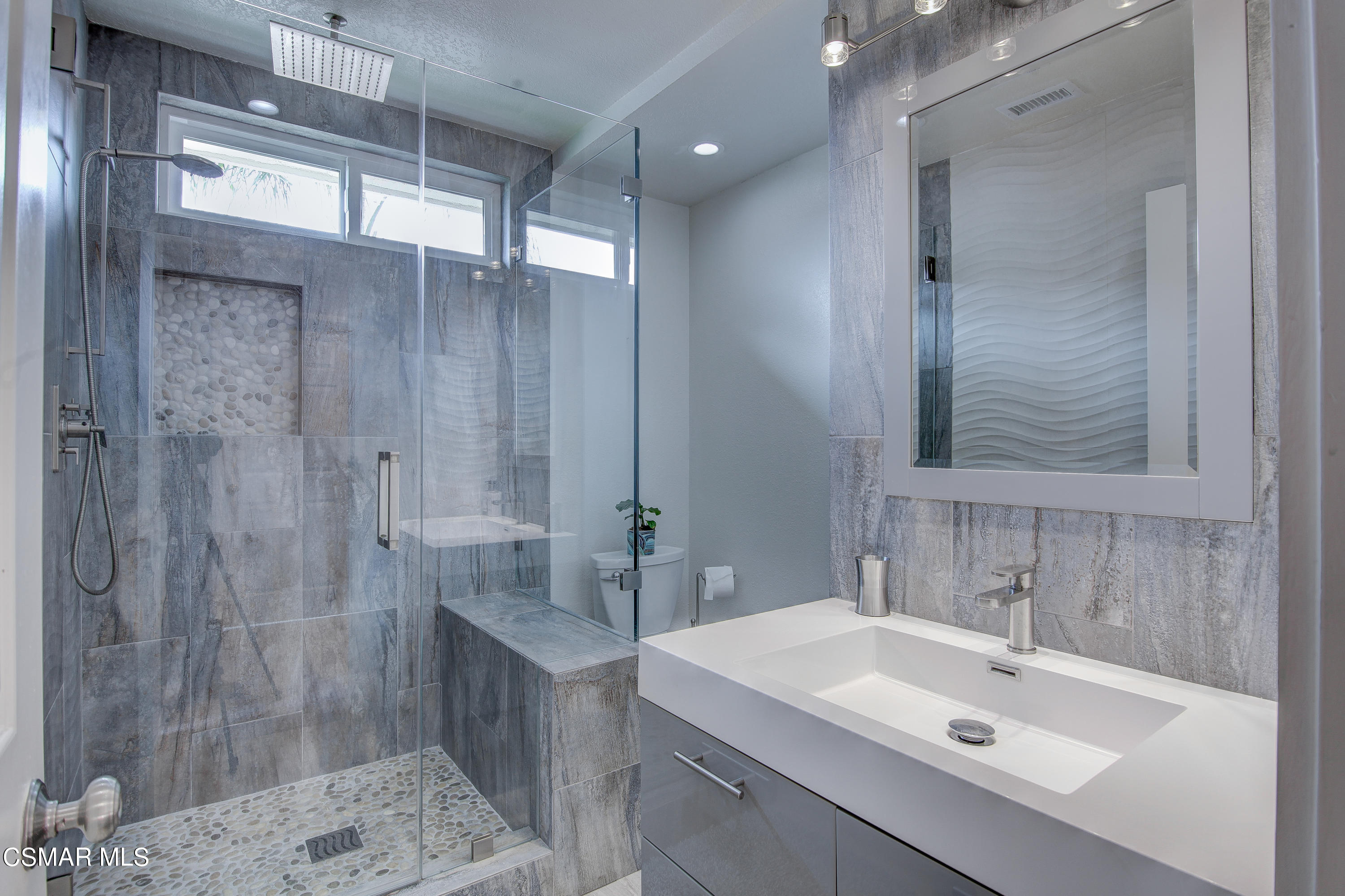445 Innwood Road Simi Valley, CA 93065 - Photo 30 of 44 a bathroom with a sink mirror and shower