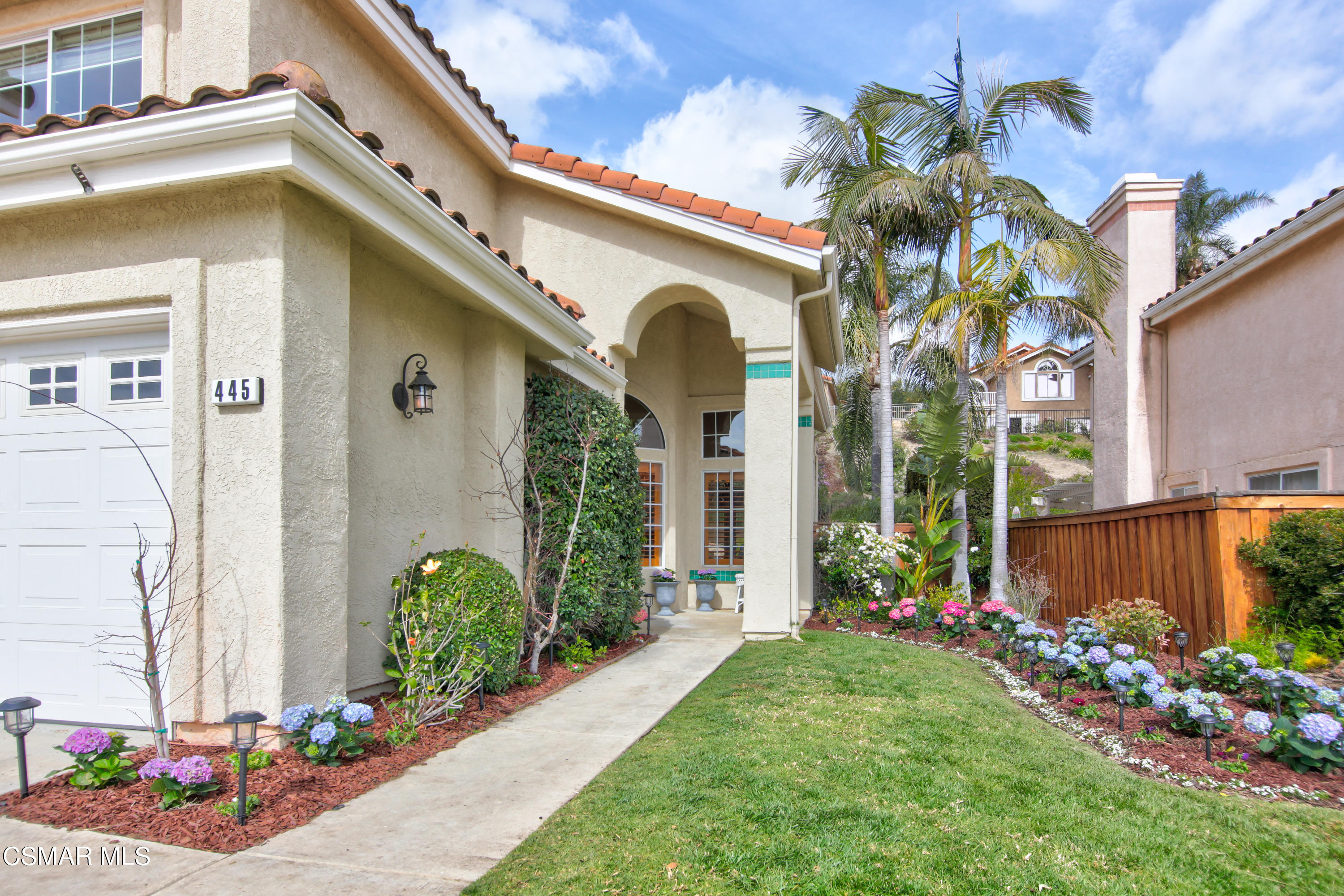 445 Innwood Road Simi Valley, CA 93065 - Photo 42 of 44 a front view of a house with a big yard and potted plants