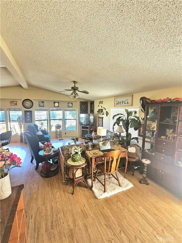 a living room with lots of furniture and a wooden floor