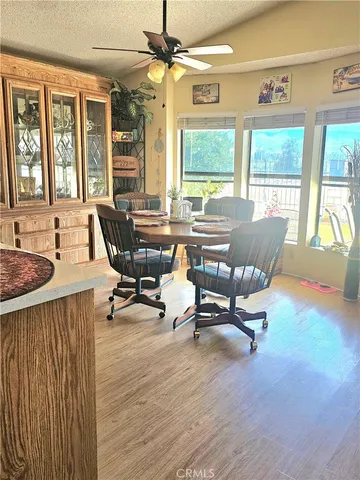 a view of a livingroom with workspace and a window