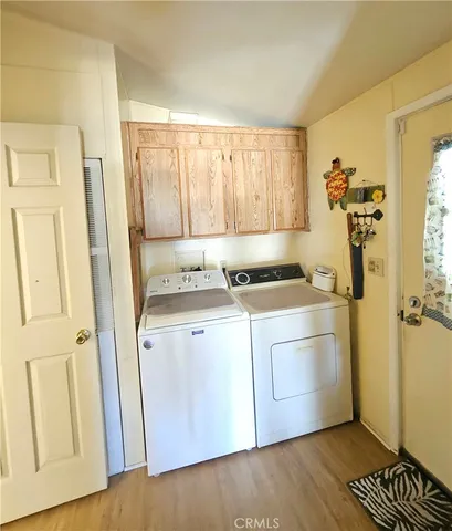 a kitchen with a refrigerator and a stove