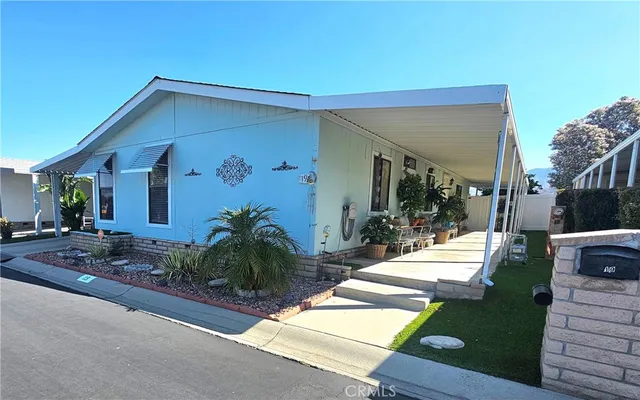 a view of a house with backyard porch and sitting area