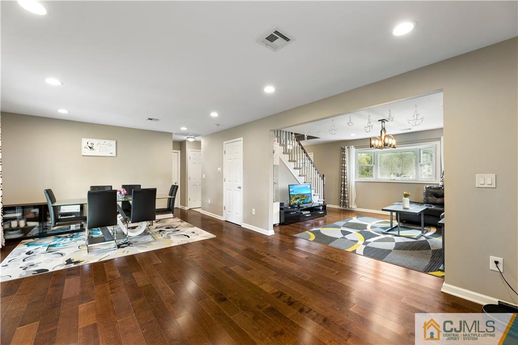 18 Baxter Road Edison, NJ 08817 - Photo 12 of 32 a room with lots of table chairs and a large window